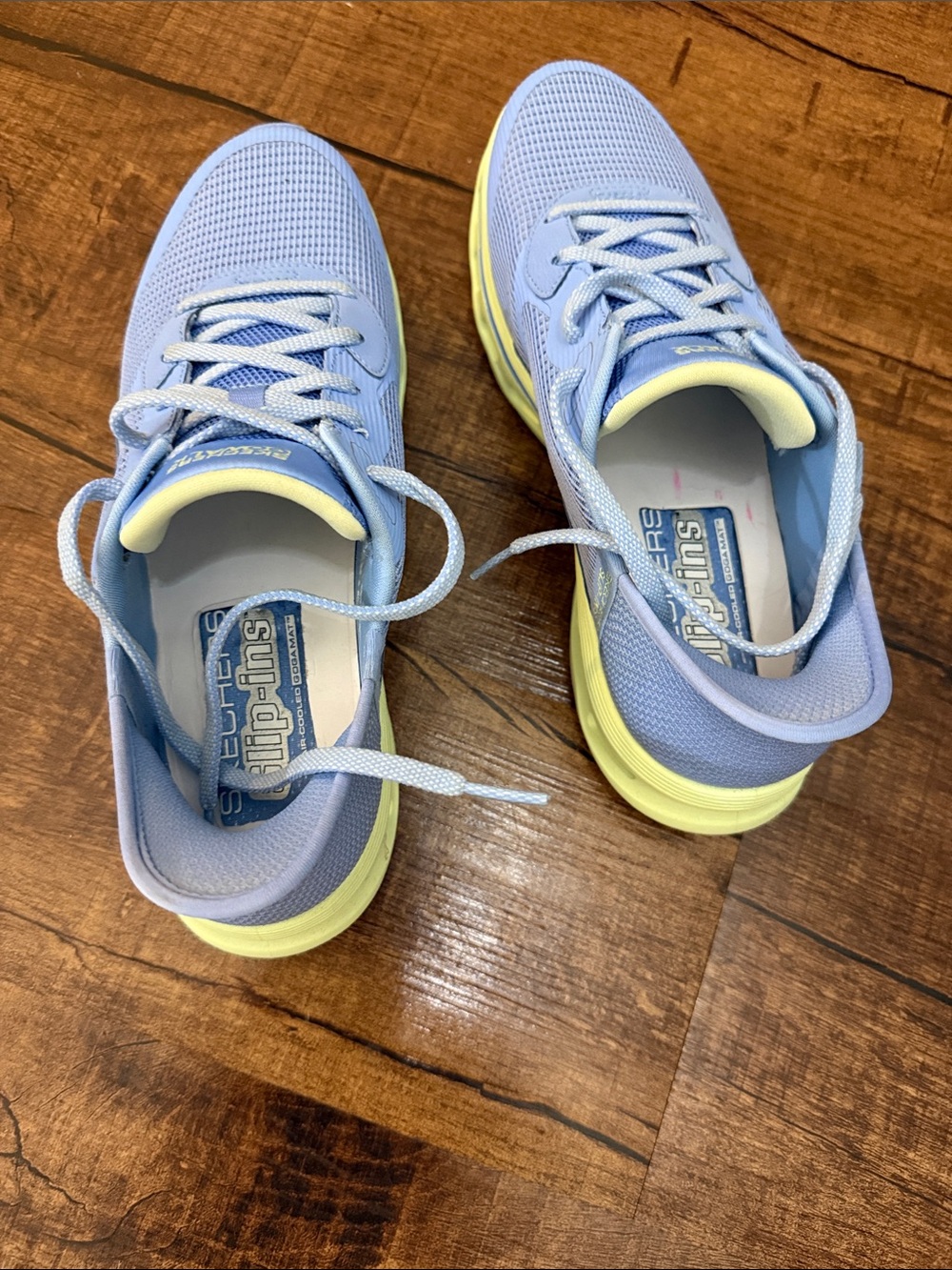 Skechers woman’s Light Blue with Yellow Accent Athletic Sneakers
